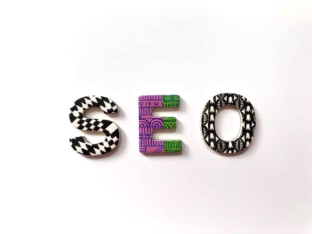 Letters spelling SEO with different patterns, representing the dilemma of SEO vs PPC.