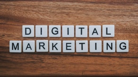 Words spelling Digital Marketing on a wooden surface.